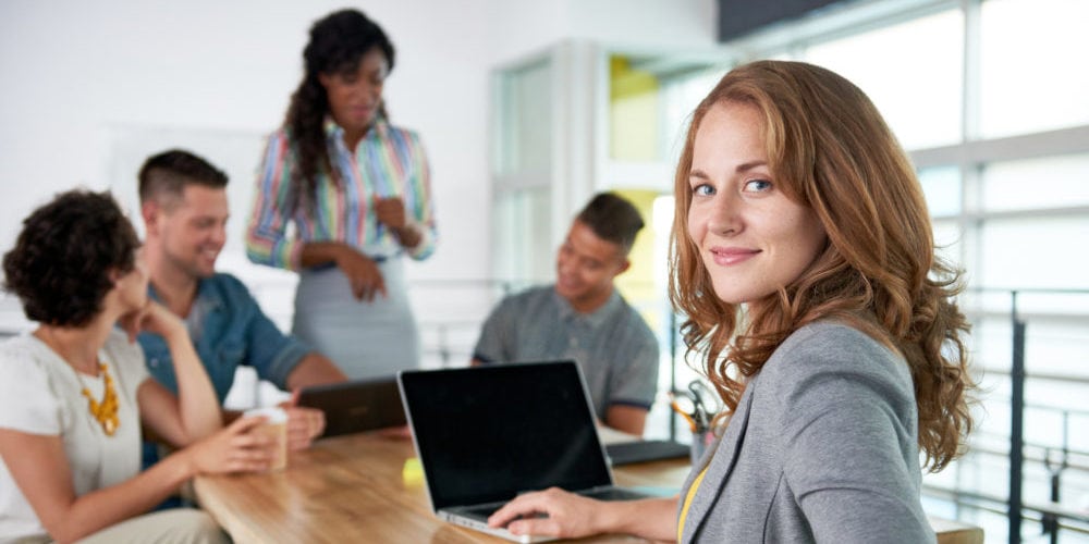 successful casual business woman using laptop