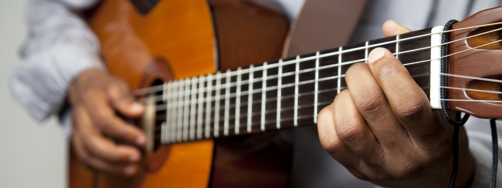 someone strumming a guitar