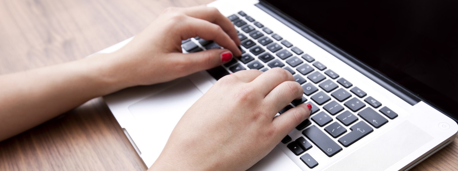 hands on the laptop keyboard